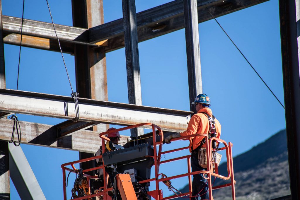 men working on steel frame